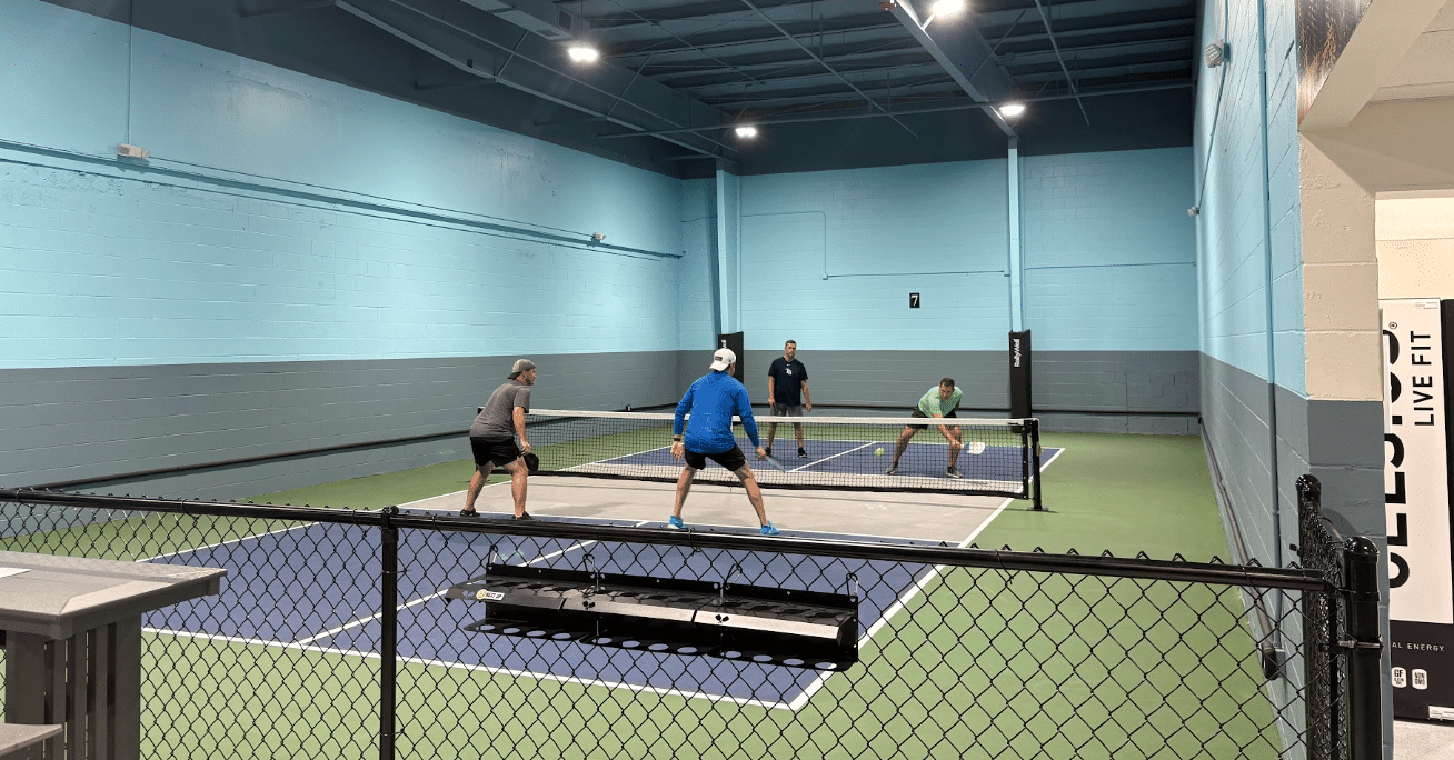 Players on the indoor pickleball courts at RallyWell