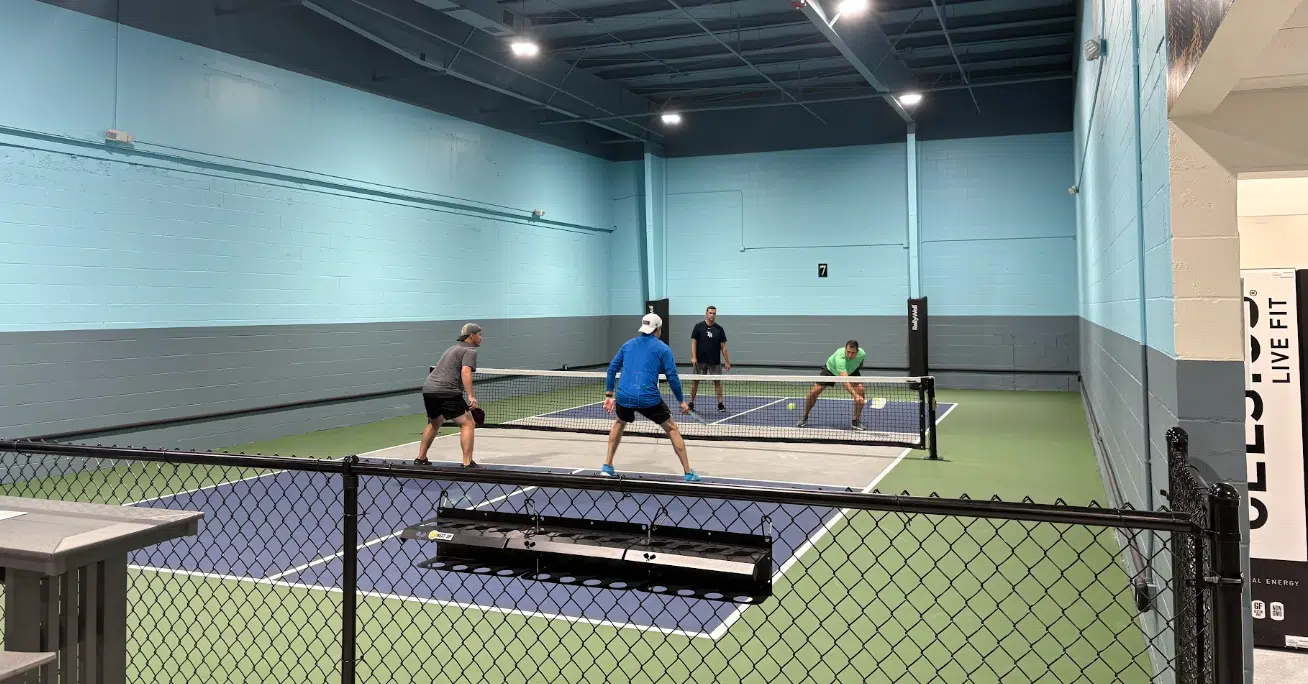 Players on the indoor pickleball courts at RallyWell